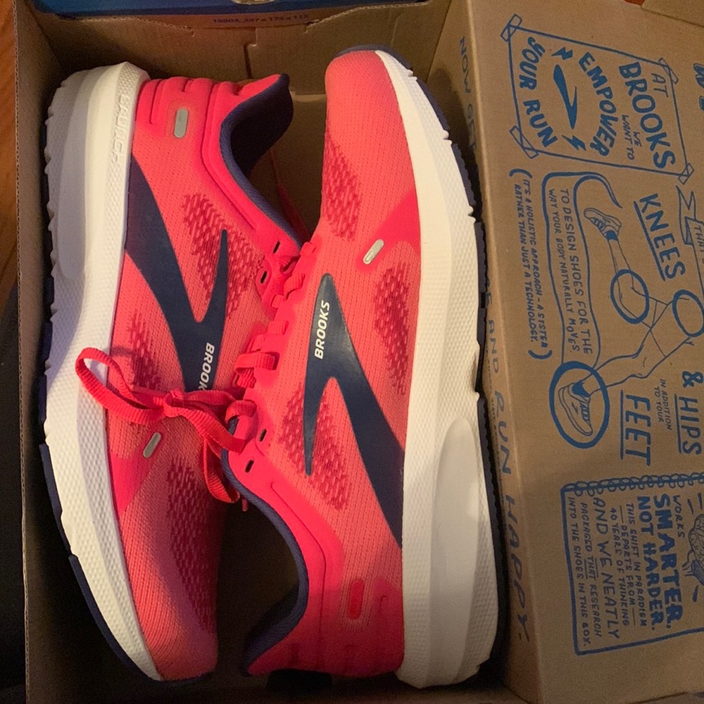 Brooks Launch 9 running shoes. Hot pink with white trim and navy details
